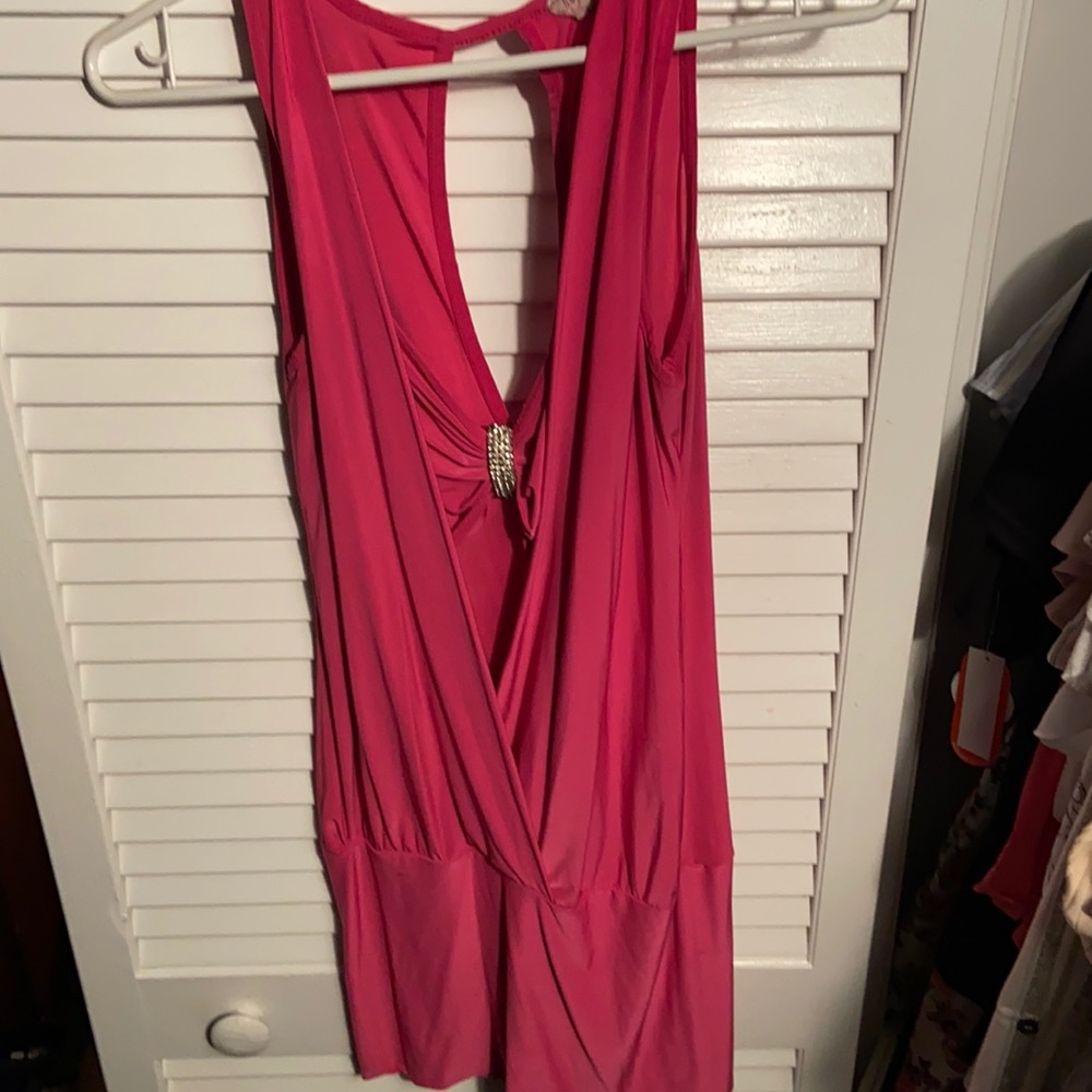 Pink sleeveless shirt. Can wear as a mini dress.